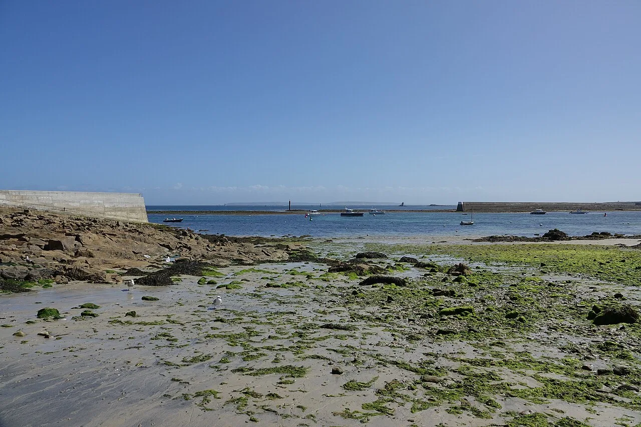 Rocky shoreline and a beach on Île de Sein